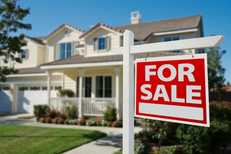 House in Background With For Sale Sign in Front. Home Again Properties, Leading San Antonio Real Estate Investors, We Buy Houses In San Antonio For Cash In Any Condition